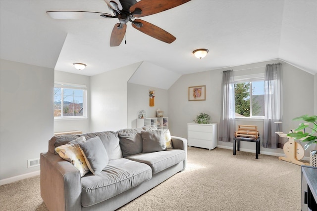 17321 E Morningside Ln, Spokane Valley, WA 99016 - living area with light carpet, a ceiling fan, vaulted ceiling, and baseboards