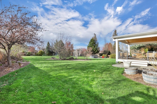 17321 E Morningside Ln, Spokane Valley, WA 99016 - view of green lawn featuring a wooden deck