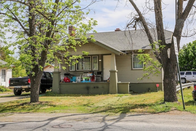 2208 N Park Rd, Spokane Valley, WA 99212 - view of front of home with a porch, a shingled roof, and a chimney