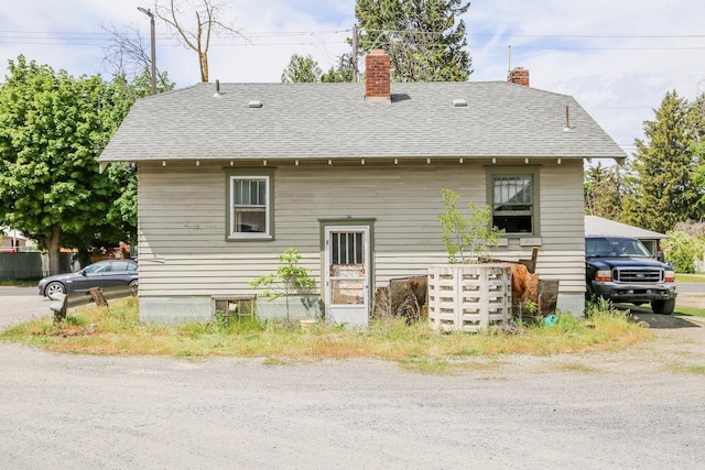 2208 N Park Rd, Spokane Valley, WA 99212 - back of house with a chimney and roof with shingles