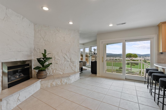 17500 E Wellesley Ave, Spokane Valley, WA 99216 - living area featuring light tile patterned floors, recessed lighting, and a fireplace