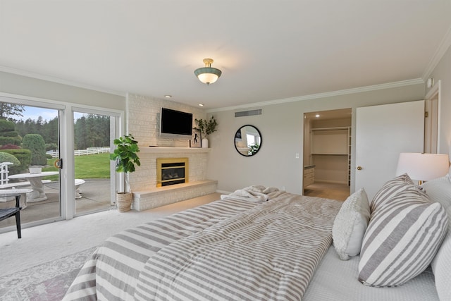 17500 E Wellesley Ave, Spokane Valley, WA 99216 - carpeted bedroom featuring access to exterior, crown molding, and a large fireplace