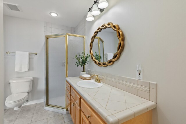 17500 E Wellesley Ave, Spokane Valley, WA 99216 - full bath with vanity, toilet, a shower stall, and tile patterned floors