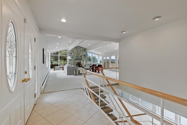 17500 E Wellesley Ave, Spokane Valley, WA 99216 - foyer with a baseboard heating unit, a stone fireplace, light tile patterned floors, light colored carpet, and recessed lighting