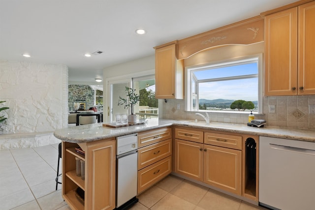 17500 E Wellesley Ave, Spokane Valley, WA 99216 - kitchen featuring dishwasher, open shelves, light tile patterned floors, a sink, and decorative backsplash