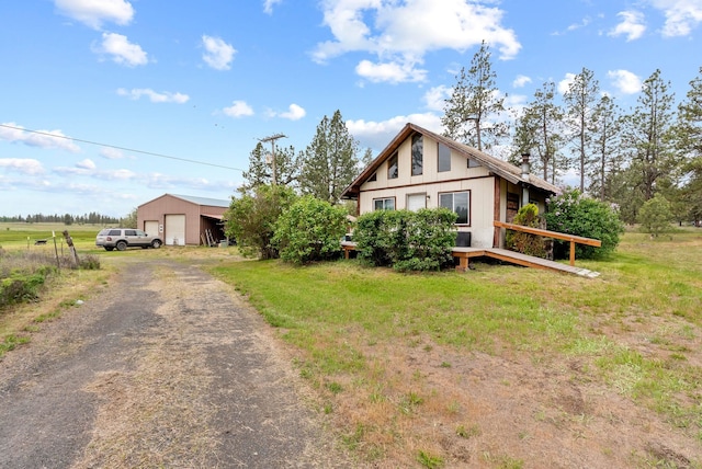 6500 W Soledad Ln, Cheney, WA 99004 - view of front of home featuring a detached garage, an outbuilding, and a chimney