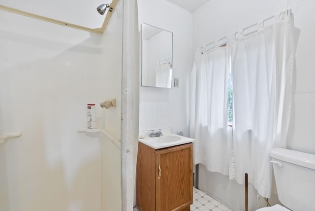 6500 W Soledad Ln, Cheney, WA 99004 - bathroom with vanity, toilet, a shower, and tile patterned floors