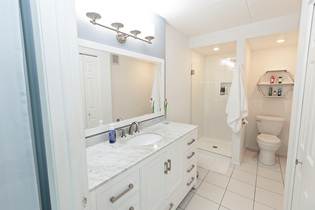 136 E Rockwood Blvd Unit 201, Spokane, WA 99202 - bathroom featuring a stall shower, toilet, vanity, and tile patterned floors