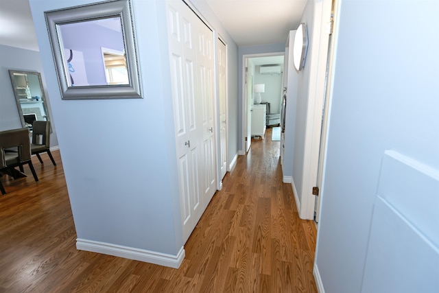 136 E Rockwood Blvd Unit 201, Spokane, WA 99202 - corridor featuring wood finished floors, baseboards, and a wall mounted AC