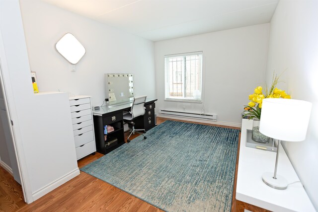 136 E Rockwood Blvd Unit 201, Spokane, WA 99202 - office with a baseboard radiator, wood finished floors, and baseboards