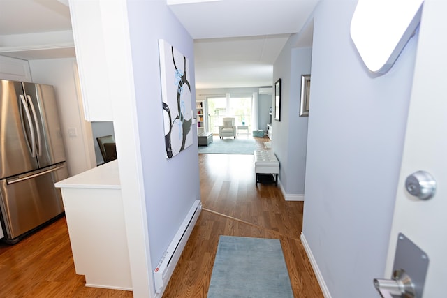 136 E Rockwood Blvd Unit 201, Spokane, WA 99202 - hall featuring a baseboard heating unit, dark wood-style flooring, baseboards, and attic access