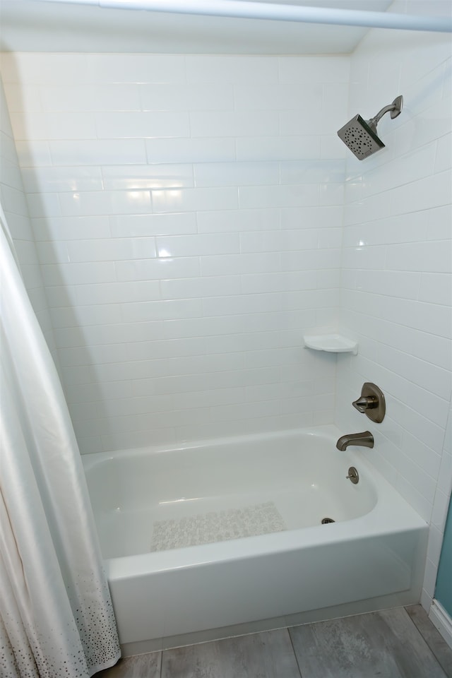 136 E Rockwood Blvd Unit 201, Spokane, WA 99202 - full bathroom with shower / bath combo with shower curtain and wood finished floors