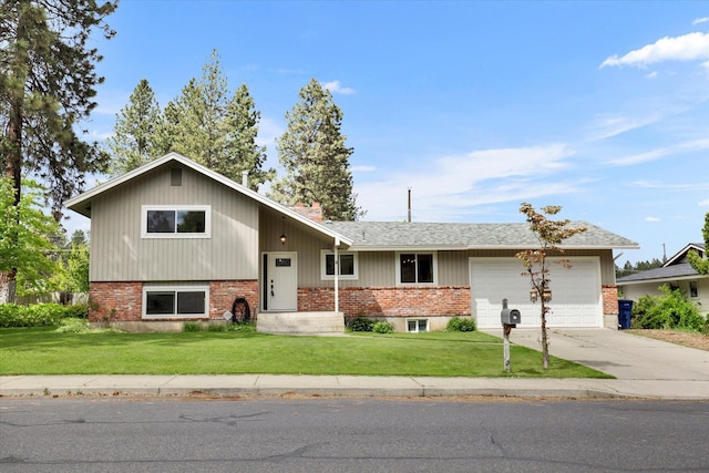 4 W Regina Ave, Spokane, WA 99218 - view of front facade with concrete driveway, brick siding, a garage, and a front lawn