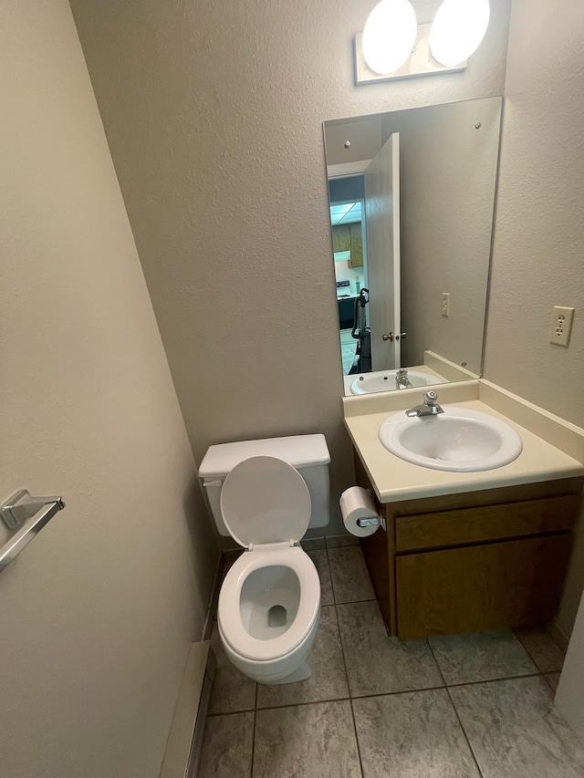 7878 N Wilding Dr Unit 14, Spokane, WA 99208 - bathroom featuring tile patterned flooring, toilet, and vanity