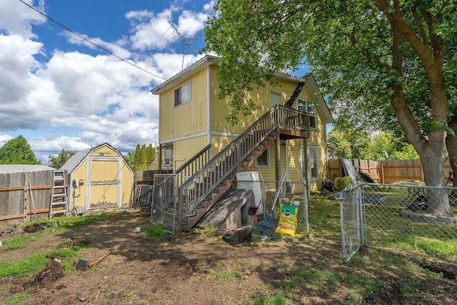 802 10th St, Davenport, WA 99122 - rear view of house featuring stairway, a fenced backyard, and a wooden deck