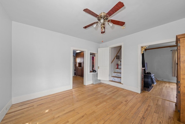 802 10th St, Davenport, WA 99122 - unfurnished room with light wood-type flooring, stairs, ceiling fan, and baseboards