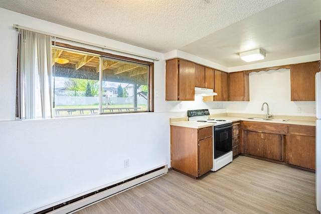 16108 E Broadway Avenue 16110E Broadway Ave, Spokane Valley, WA 99037 - kitchen featuring electric stove, a baseboard radiator, a sink, under cabinet range hood, and brown cabinetry
