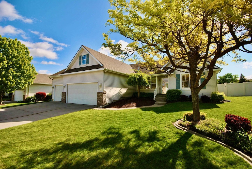 503 S Lone Tree Rd, Spokane Valley, WA 99016 - view of front facade featuring driveway, an attached garage, and roof with shingles