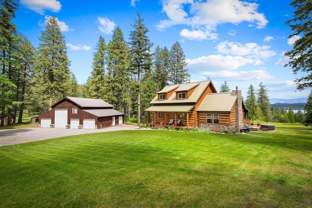 3475B Waitts Lake Rd, Valley, WA 99181 - cabin featuring a chimney, a garage, a porch, an outbuilding, and a front lawn