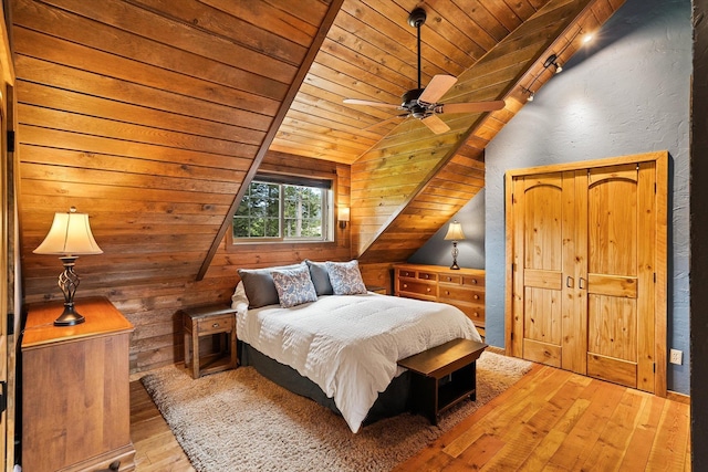 3475B Waitts Lake Rd, Valley, WA 99181 - bedroom featuring wooden ceiling, vaulted ceiling, wood-type flooring, wood walls, and ceiling fan
