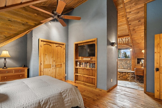 3475B Waitts Lake Rd, Valley, WA 99181 - bedroom with vaulted ceiling, hardwood / wood-style floors, wood ceiling, a textured wall, and baseboards