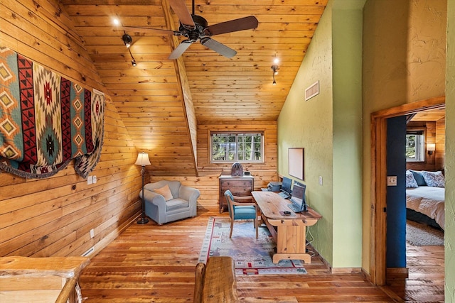 3475B Waitts Lake Rd, Valley, WA 99181 - sitting room with hardwood / wood-style floors, vaulted ceiling, ceiling fan, wood ceiling, and wooden walls