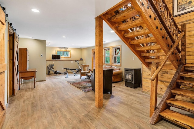 3475B Waitts Lake Rd, Valley, WA 99181 - living area with a barn door, stairs, light wood finished floors, and recessed lighting