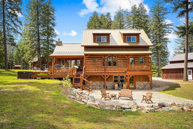 3475B Waitts Lake Rd, Valley, WA 99181 - back of house featuring stone siding, a yard, a deck, a patio, and a chimney