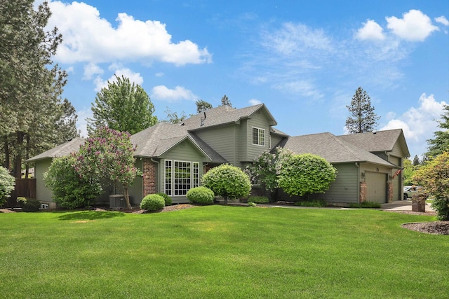 15314 N Gleneden St, Spokane, WA 99208 - view of front of property with a garage, a front yard, central AC unit, and roof with shingles