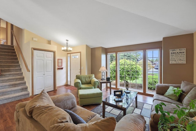 15314 N Gleneden St, Spokane, WA 99208 - living area with lofted ceiling, stairs, wood finished floors, and a chandelier