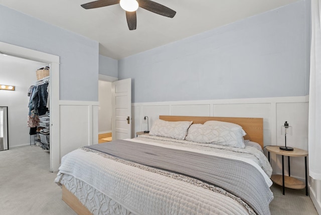 1116 E Newark Ave, Spokane, WA 99202 - bedroom with carpet, a decorative wall, a spacious closet, wainscoting, and a closet