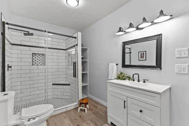 1116 E Newark Ave, Spokane, WA 99202 - bathroom featuring toilet, vanity, wood finished floors, and a stall shower