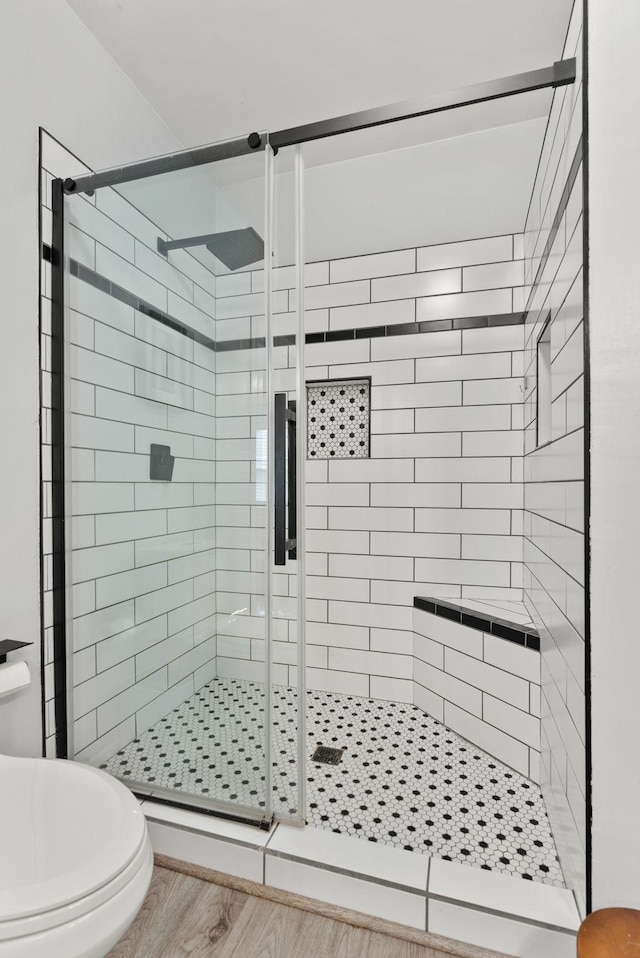 1116 E Newark Ave, Spokane, WA 99202 - bathroom featuring toilet, a shower stall, and wood finished floors
