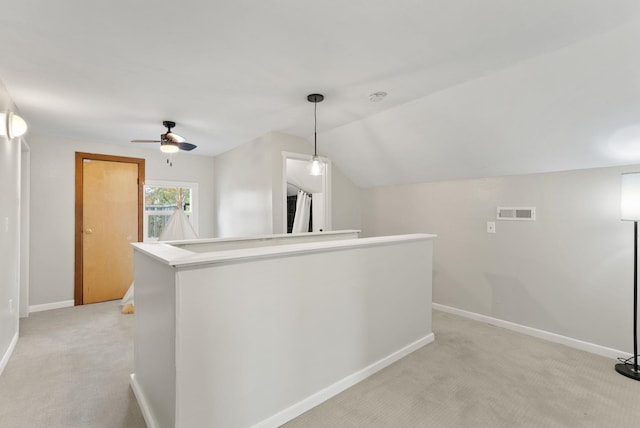 1116 E Newark Ave, Spokane, WA 99202 - hallway featuring light colored carpet, baseboards, lofted ceiling, and an upstairs landing