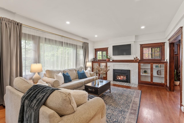 1116 E Newark Ave, Spokane, WA 99202 - living area with wood finished floors, recessed lighting, and a brick fireplace