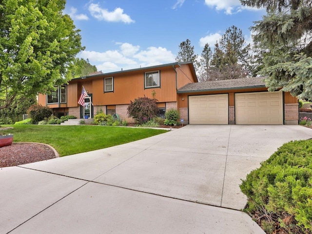 11723 S Player Dr, Spokane, WA 99223 - view of front of property featuring a front lawn, concrete driveway, and an attached garage
