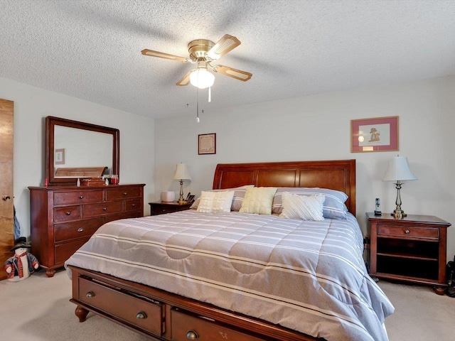 11723 S Player Dr, Spokane, WA 99223 - bedroom with light colored carpet, a textured ceiling, and ceiling fan