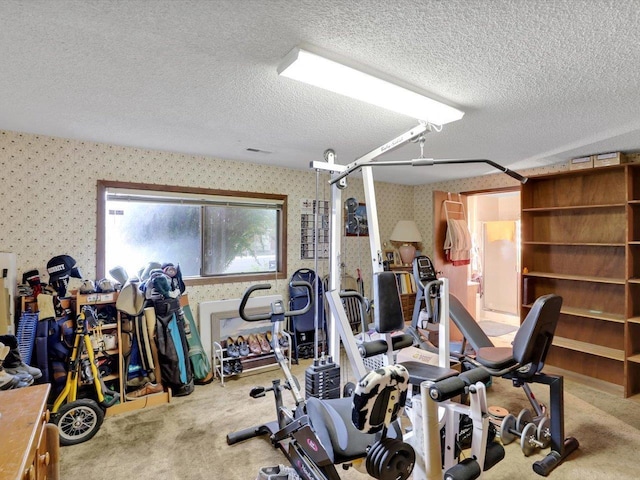 11723 S Player Dr, Spokane, WA 99223 - exercise room featuring wallpapered walls, carpet flooring, and a textured ceiling