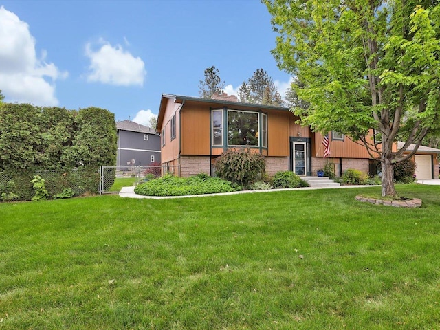 11723 S Player Dr, Spokane, WA 99223 - split foyer home featuring a chimney and a garage