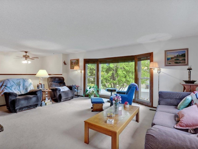 11723 S Player Dr, Spokane, WA 99223 - living area featuring light colored carpet, ceiling fan, and a textured ceiling