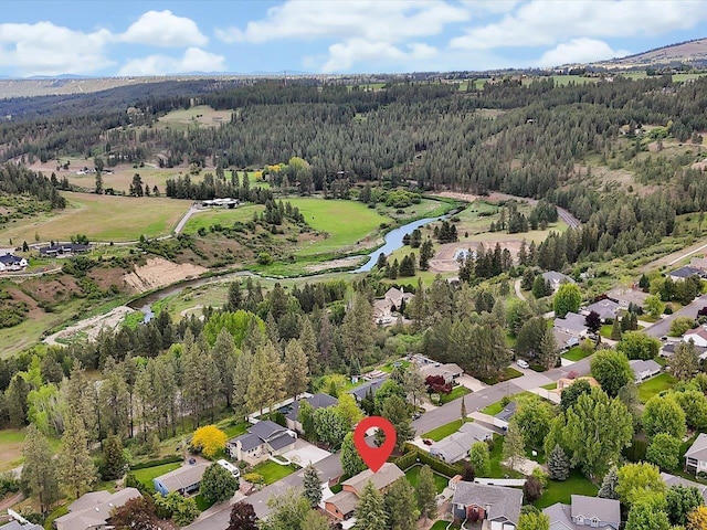 11723 S Player Dr, Spokane, WA 99223 - aerial perspective of suburban area featuring a heavily wooded area and a nearby body of water