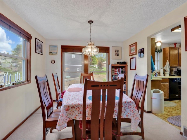 11723 S Player Dr, Spokane, WA 99223 - dining space featuring a chandelier, light carpet, baseboards, and a textured ceiling