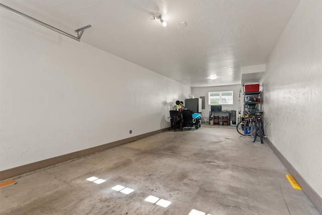 4461 W Greenchain Loop # 5, Coeur D Alene, ID 83814 - garage featuring baseboards
