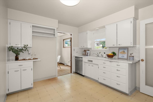 4218 N E St, Spokane, WA 99205 - kitchen featuring dishwasher, light floors, a sink, backsplash, and white cabinets