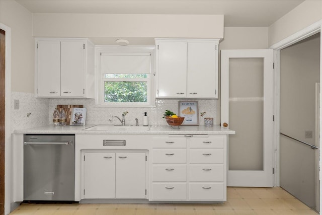 4218 N E St, Spokane, WA 99205 - kitchen featuring dishwasher, a sink, light floors, and white cabinets