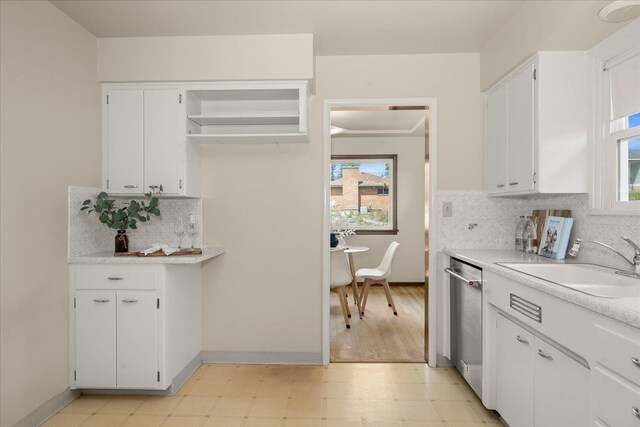 4218 N E St, Spokane, WA 99205 - kitchen featuring stainless steel dishwasher, light floors, a sink, and light countertops