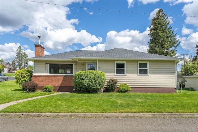 4218 N E St, Spokane, WA 99205 - single story home featuring a front yard, a chimney, and brick siding