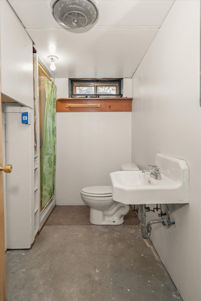 4218 N E St, Spokane, WA 99205 - full bath featuring unfinished concrete flooring, curtained shower, toilet, and a sink