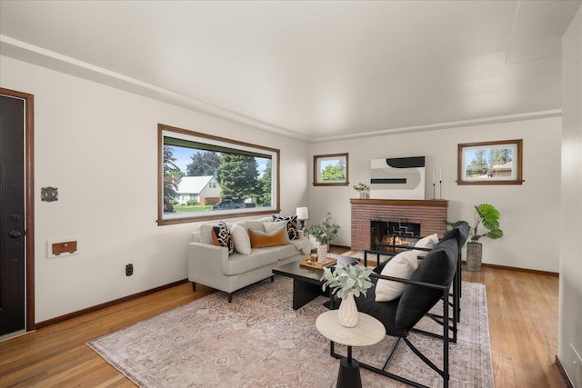 4218 N E St, Spokane, WA 99205 - living room with a fireplace, wood finished floors, and baseboards