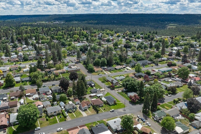 4218 N E St, Spokane, WA 99205 - aerial view of property and surrounding area featuring a forest and nearby suburban area